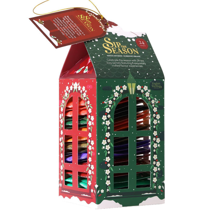 Front 3/4 view of English Tea Shop Lantern Assortment box showing red and green cut-out windows on a white background.