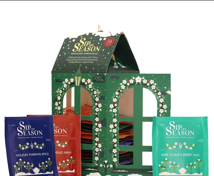 English Tea Shop Lantern Assortment box displayed with colorful individual tea sachets in front on a white background.